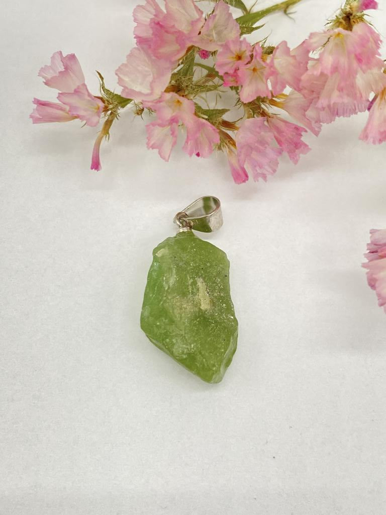 Peridot rough stone with silver eyelet